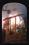 Woman weaving on a hand loom 1911