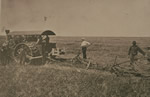 The first steam tractor owned by the Doukhobor commune, with Peter Verigin behind it