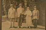 Verigin and Mary Strelaeff with community officials Max Baskin (left) and Fyodore Hlookoff (right)