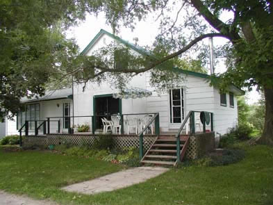 [ The Donnelly Homestead Today, The middle section of the home that stands today was constructed by Patrick, William and Robert in 1881.  Today the site is owned by the Salts family.  Thanks to Robert Salts, present-day owner of the Donnelly Homestead, who allowed this photograph to be taken. Copyright Great Unsolved Canadian Mysteries Project, Jennifer Pettit,   ]