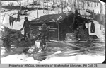 Three men in front of Wadsworth cabin, Skookum Gulch
