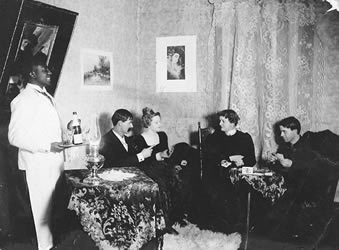 [ Social scene showing interior of parlor, Dawson ]