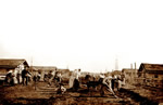 Doukhobor women and children building street in Saskatchewan village about 1899.  Men were away performing paid labor on railroads.