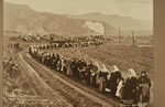 A crowd lines the road from Verigin's home, waiting for the bier to pass